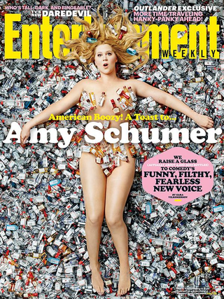 Illustration for article titled Amy Schumer Is Nude and Covered In Trash On the Cover of EW